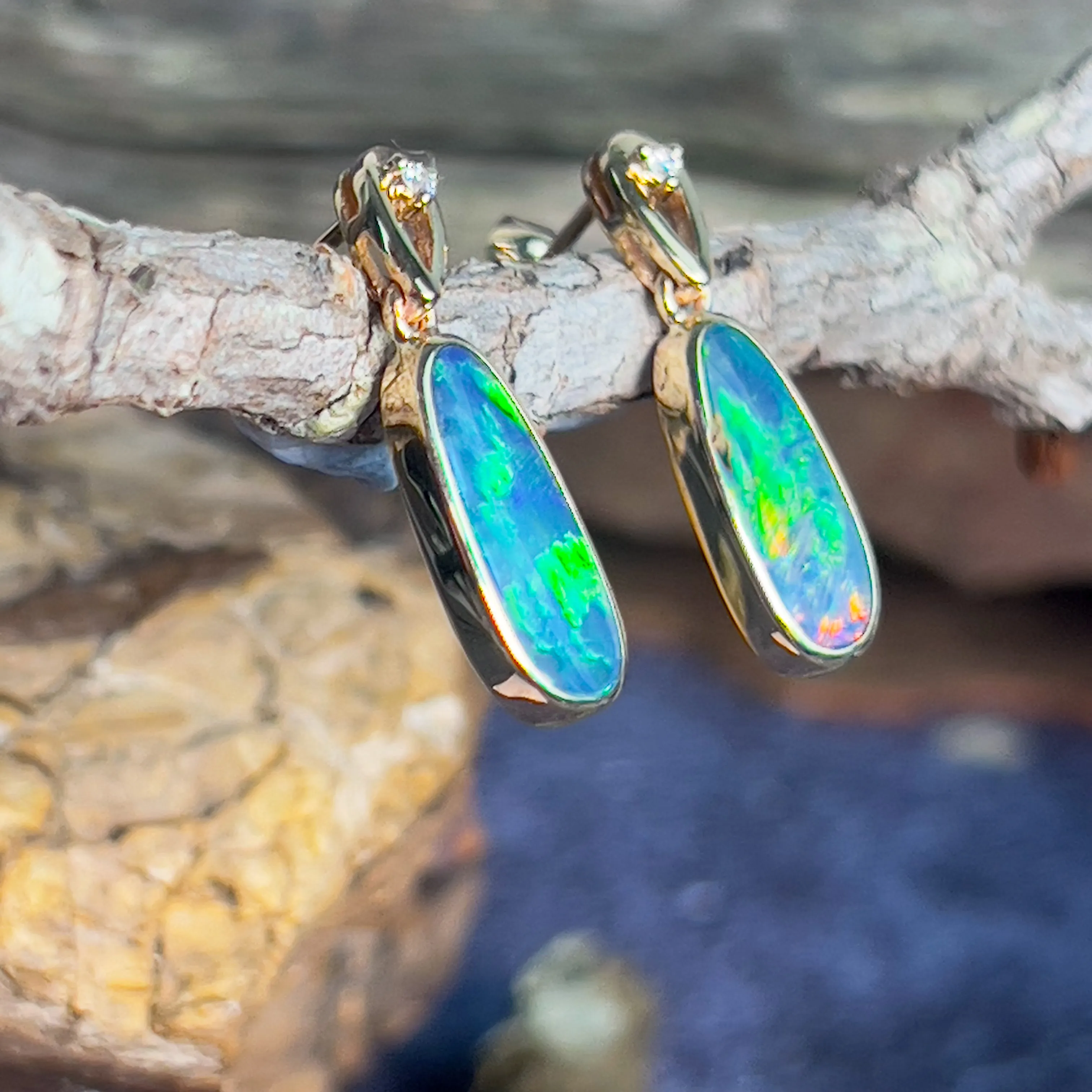 14kt Yellow Gold dangling earrings set with Opal doublets and diamonds