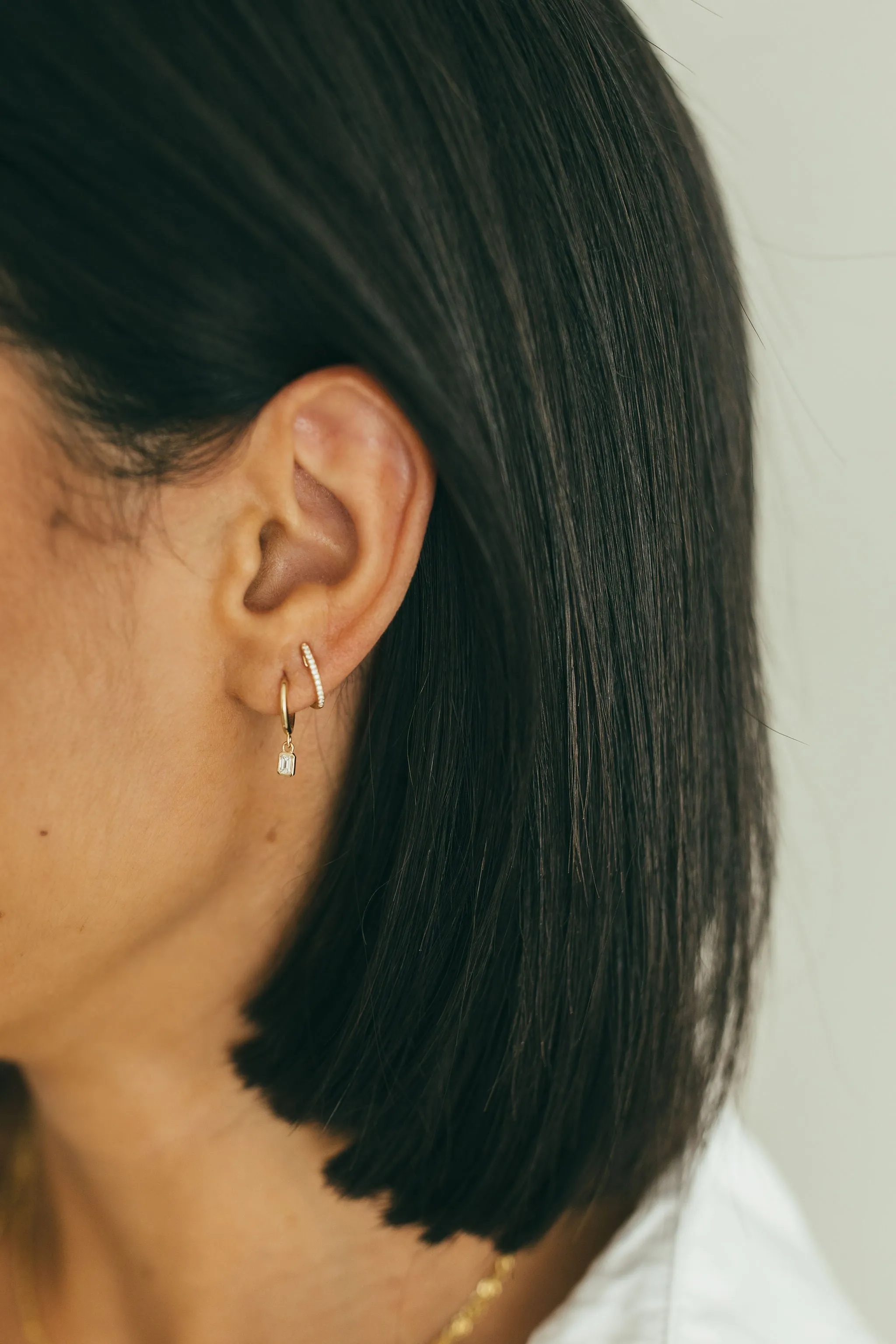 Dangling Emerald Diamond Bezel Huggie Earrings